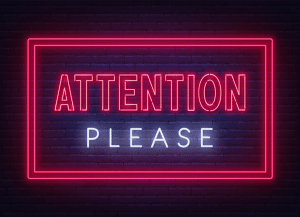 Schriftzug "Attention Please"